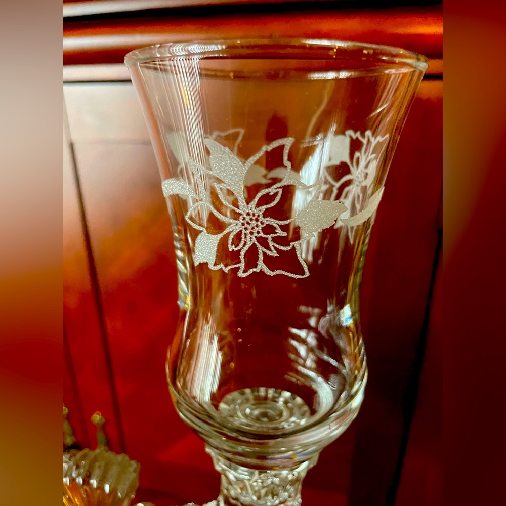 Votive poinsettia holders with base.